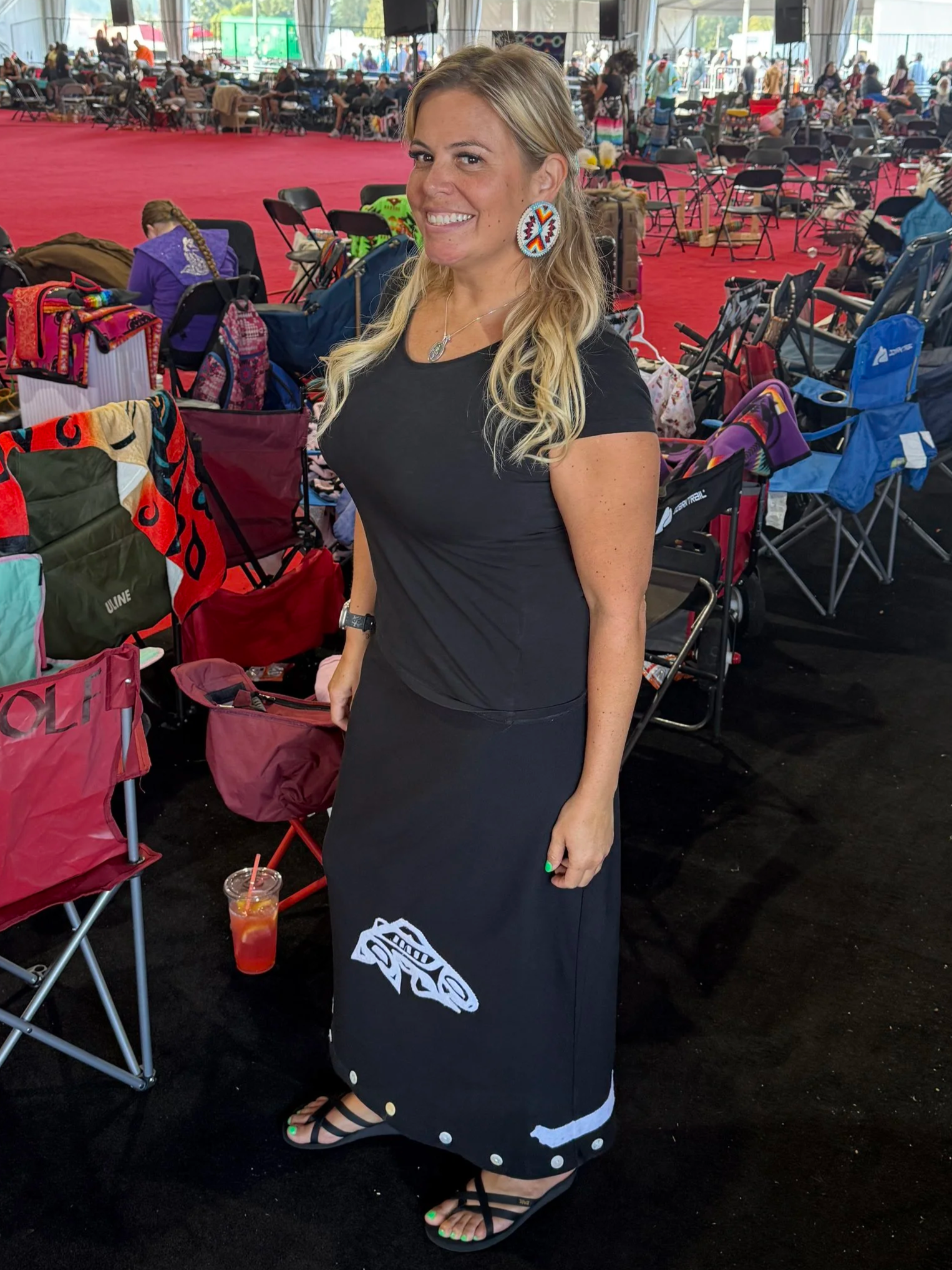 Bettina at a powwow in a traditional ribbon skirt
