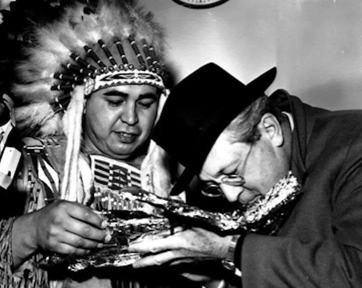 Historic photograph of tribal members in regalia